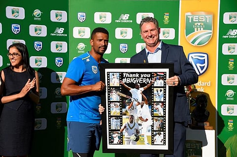 South Africa's Vernon Philander (C) is handed a momentum token from Cricket South Africa (CSA) CEO Jacue Faul (R) during the fourth day of the fourth Test cricket match between South Africa and England at the Wanderers Stadium in Johannesburg. (Photo | AF