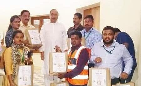 Officials of Paradip Municipality presenting compost produced from waste to CM Naveen Patnaik.