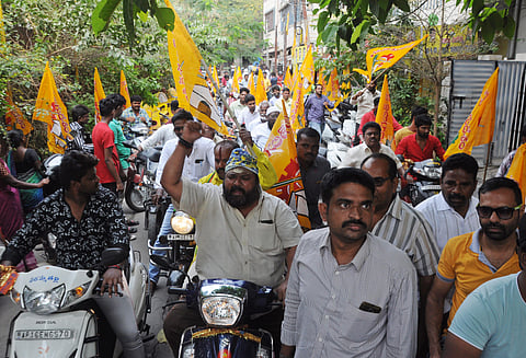 TDP activists take out a bike rally in protest against the government move to scrap Legislative Council, at One Town in Vijayawada on Tuesday. (Photo| Prasant Madugula, EPS)
