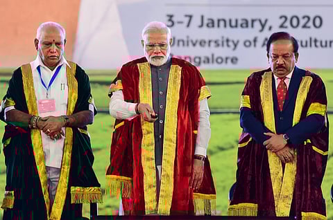 PM Narendra Modi launches the I-STEM portal as Science and Technology Minister Harsh Vardhan (R) and Karnataka Chief Minister B S Yediyurappa (L) look on during the inauguration of 107th Indian Science Congress at the University of Agricultural Sciences i