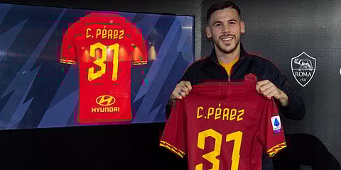 Carles Perez poses with his new jersey in Rome. (Photo | AP)