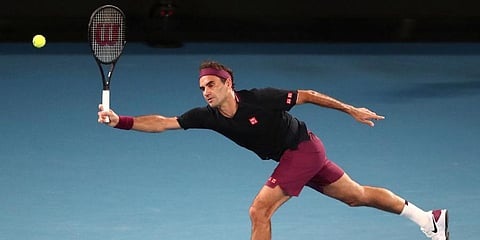 Roger Federer makes a forehand return to Novak Djokovic during their semifinal match at the Australian Open tennis championship in Melbourne. (Photo | AP)