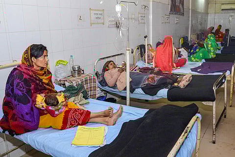 Sick children in the laps of their mothers take treatments at the JK Lon hospital where at least 100 infants have died in the month of December as per reports in Kota district Friday Jan. 3 2020.  (Photo | PTI)