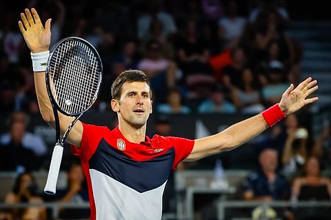 Novak Djokovic of Serbia celebrates his victory against Kevin Anderson of South Africa during their men's singles match on day two of the ATP Cup tennis tournament in Brisbane. (Photo | AFP)