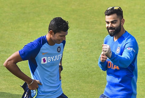 Indian skipper Virat Kohli with teammate Navdeep Saini during a training session ahead of the 1st T20 Match against Sri Lanka at Barsapara Cricket Stadium in Guwahati. (Photo | PTI)