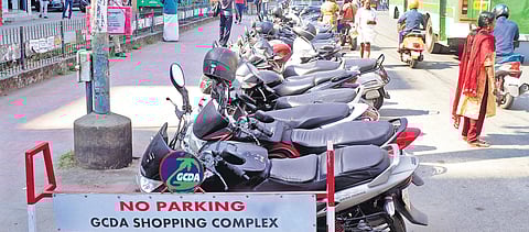 Two-wheelers parked near a  no-parking zone at in the city   A Sanesh