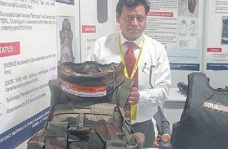 Rajesh Jaish, technical officer at the DMSRDE laboratory, Kanpur, displays the lightweight bullet-proof jacket  | Express