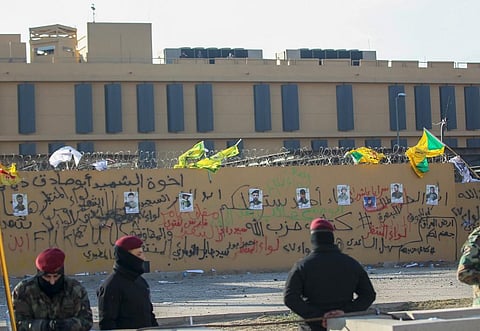 Portraits of fighters from Kataeb Hezbollah (Hezbollah Brigades) seen on the wall of the US embassy in the Iraqi capital of Baghdad (File photo| AFP)