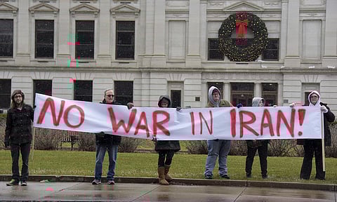 An anti-war rally is hosted by United Activists of Fort Wayne Indiana and Fort Wayne for Peace to protest for peace and diplomacy in response to the latest U.S. airstrike of Iraqis, at the Allen County Courthouse in Fort Wayne, Ind. (Photo | AP)