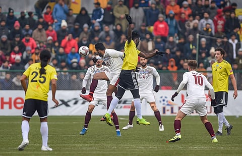 Real Kashmir FC in yellow and Mohun Bagan player in action during I-League match in Srinagar. (Photo | PTI)