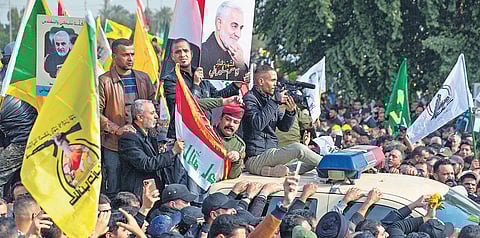 Mourners march during the funeral of Iran’s top general Qasem Soleimani, and Abu Mahdi al-Muhandis, deputy commander of Iranbacked militias in Iraq known as the Popular Mobilisation Forces, in Baghdad; (Below) Protests in Lucknow against the killing. (Pho