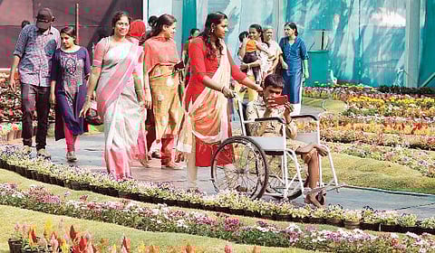 Sravan (sitting in the wheelchair), a student of SDPY KPMHS, Edavanakad, along with his sister at Cochin Flower Show in Ernakulathappan ground on Saturday  Arun Angela