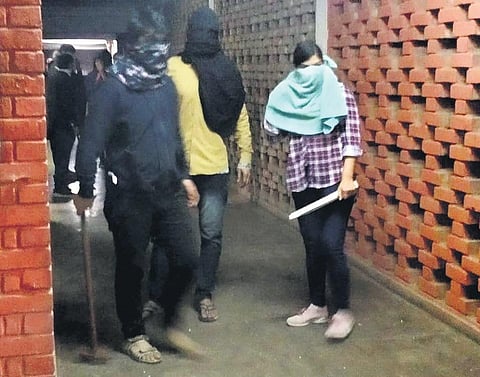 Masked miscreants roaming around JNU campus. (Photo| PTI)