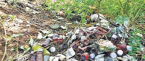 Tablet strips and bottles of pills found dumped along the Adyar river banks near Anakaputhur in the city. (Photo| EPS)