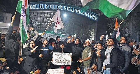 Students protest outside the Police HQ at ITO, in New Delhi on Sunday night. (Photo | Parveen Negi)