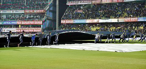 Groundsman removing pitch cover after rain stopped during 1st T20 Match between India and Sri Lanka at Barsapara Cricket Stadium in Guwahati. (Photo | PTI)