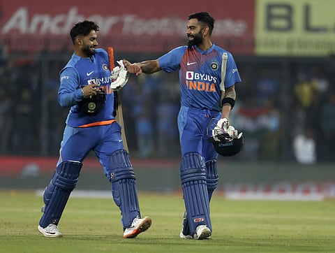 India's captain Virat Kohli, right, and teammate Rishabh Pant celebrate their win in the second T20I cricket match between India and Sri Lanka in Indore, India, Tuesday. (Photo | AP)