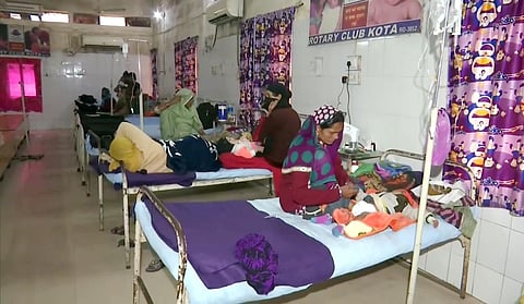 Family members with their children who are admitted to JK Lone Hospital, in Kota on Friday (Photo| ANI)