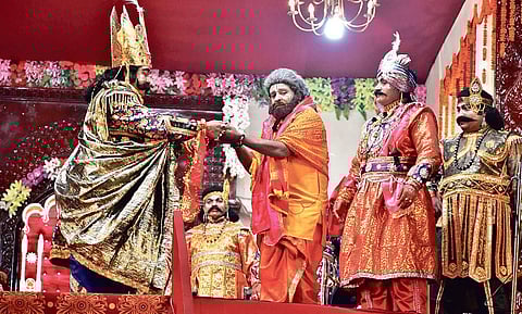 Lalit Mohan Panda (centre) along with King Kansa and other characters during an act at Rang Sabha in Bargarh| EXPRESS