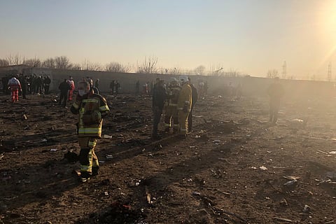 Debris is seen from a plane crash on the outskirts of Tehran, Iran. (Photo | AP)