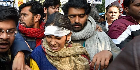 JNUSU president Aishe Ghosh and other students during a protest march from Mandi House to HRD Ministry, demanding removal of the university vice-chancellor, in New Delhi. (Photo | PTI)