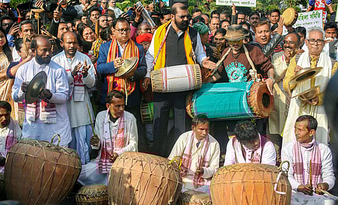 Singer Zubeen Garg with All Assam Students Union AASU chief advisor Samujjal Bhattcharjya and AASU President Dipankar Kumar Nath and other artists from different part of Assam play traditional instruments during the 'Ran Singa' protest against the Citizen