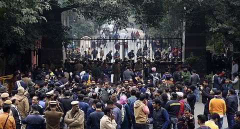 Police personnel guard as students and media are also seen at the main gate of the Jawaharlal Nehru University JNU in New Delhi on Monday January 6 2020. (Photo | Shekhar Yadav/EPS)