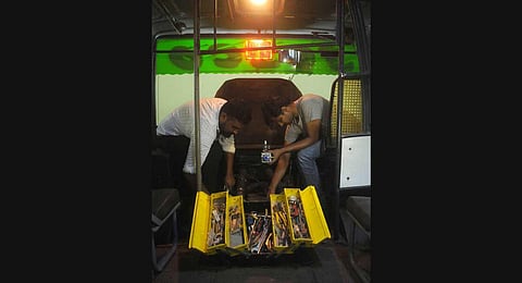 Workers carrying out retrofitting in a private bus at Edappally. (Photo | A Sanesh, EPS)