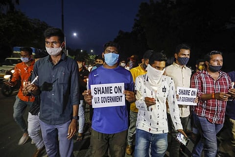 NSUI activists hold a candlelight march to pay homage to Hathras gang-rape victim in front of Gujarat University in Ahmedabad Wednesday Sept. 30 2020. (Photo | PTI)