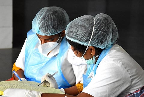 Two healthworkers collecting samples | FILE PICTURE