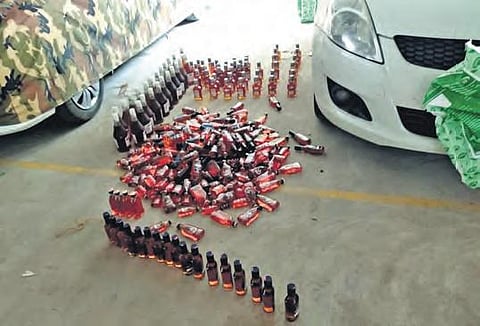 Police found Illegal liquor bottles in the car of Kanaka Durga temple trust board member at Jaggayyapet in Krishna district. (Photo | Express)