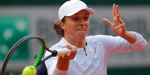 Iga Swiatek wins women's French Open to become Poland's first Grand Slam singles champion