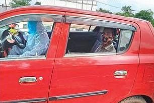 Ramchandani driving the Covid patient in his car. (Photo | EPS)