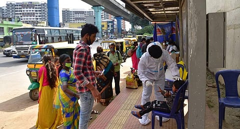 Free Covid 19 testing Done at BHEL Bus stop in Bengaluru on Wednesday. (Photo | Vinod Kumar T/EPS)