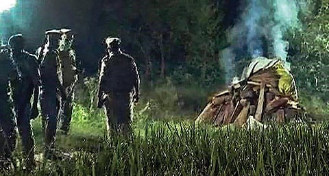 Police cremates the body of the gang-rape victim in the middle of the night in Hathras district in UP. (Photo | PTI)