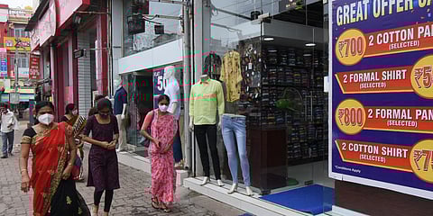 Many shops in Mysuru displaying discount offers ahead of Dasara in Mysuru on Sunday. (Photo | EPS/Udayshankar S)