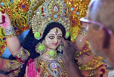 An artist gives final touches to an idol of Goddess Durga ahead of Durga Puja festival in Guwahati Tuesday Oct. 13 2020. (Photo | PTI)