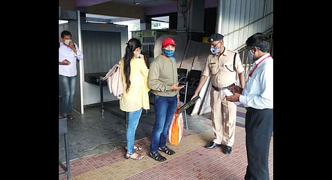 Passengers are manually scanned as rats nibbling at the cable wires have left the baggage scanner dysfunctional
