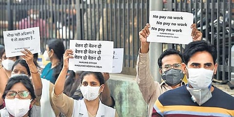 Resident doctors at their protest in Hindu Rao Hospital on Monday. (Photo | Praveen Negi, EPS)