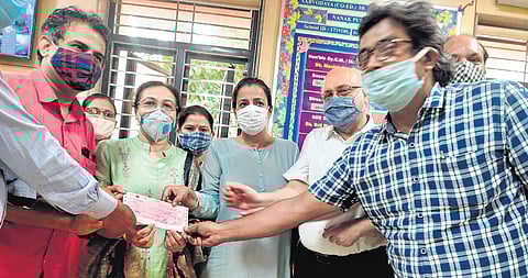 AIPA prez Ashok Agarwal & association member Teena Sharma at school. (Photo| EPS)