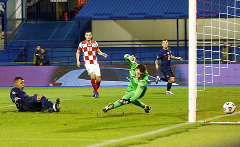 France's Kylian Mbappe, left, scores his side's second goal during the UEFA Nations League soccer match between Croatia and France (Photo | AP)