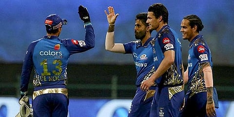 Mumbai Indians players celebrate the wicket of Kolkata Knight Riders batsman Rahul Tripathi. (Photo | PTI)