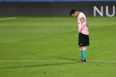 Barcelona's Lionel Messi reacts as Getafe's Jaime Mata celebrates celebrates scoring the opening goal. (Photo | AP)
