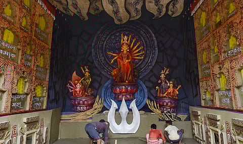 An idol of Goddess Durga at a community puja pandal ahead of the Durga Puja festival, in Kolkata. (Photo | PTI)