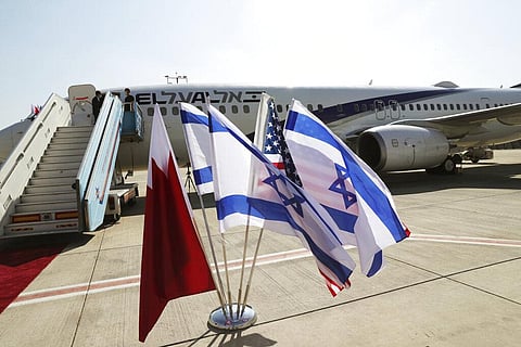 The national flags of Bahrain, Israel and America, flutter in near the Israeli flag carrier El Al plane that will fly an Israeli delegation, accompanied by U.S. aides, to Bahrain. (Photo | AP)
