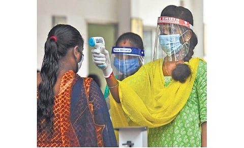 Thermal scanning of students underway before the NEET exam at a centre in Adyar | Ashwin Prasath