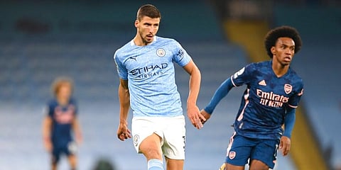 Manchester City's Ruben Dias (L) and Arsenal's Willian run for the ball during their English Premier League match. (Photo | AP)