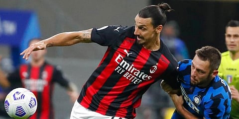 AC Milan's Zlatan Ibrahimovic and Inter Milan's Stefan de Vrij vie for the ball during the Serie A match at the San Siro Stadium. (Photo | AP)