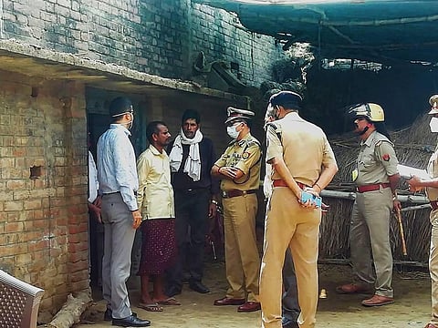 ADG of Police Brij Bhushan visits the scene of crime along with Deputy Inspector General Subhash Chandra Dubey at Bairia in Ballia district Friday Oct. 16 2020. (Photo | PTI)
