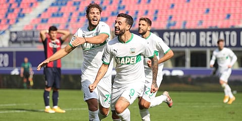 Sassuolo's Francesco Caputo celebrates with his teammate Manuel Locatelli (L) after scoring during the Serie A match against Bologna at the Renato Dall'Ara Stadium. (Photo | AP)